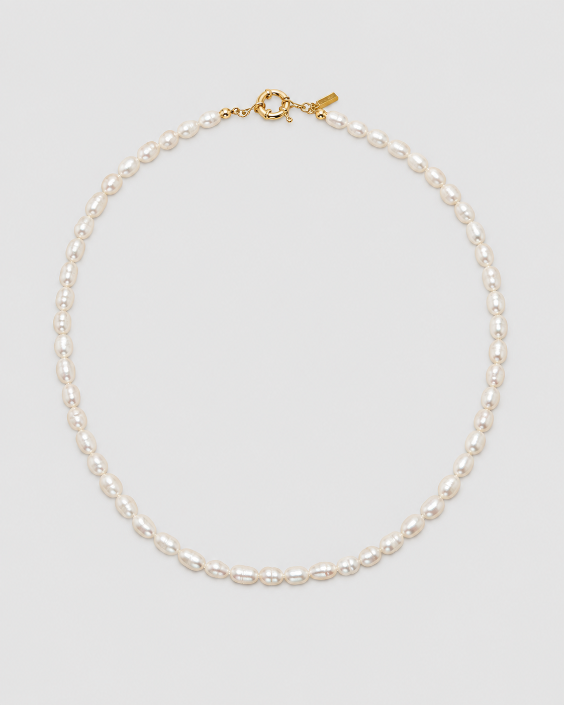 MONLANA Natural Pearl Necklace featuring irregular freshwater pearls and gold-tone clasp on a light grey background