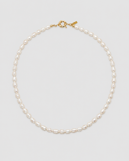 MONLANA Natural Pearl Necklace featuring irregular freshwater pearls and gold-tone clasp on a light grey background