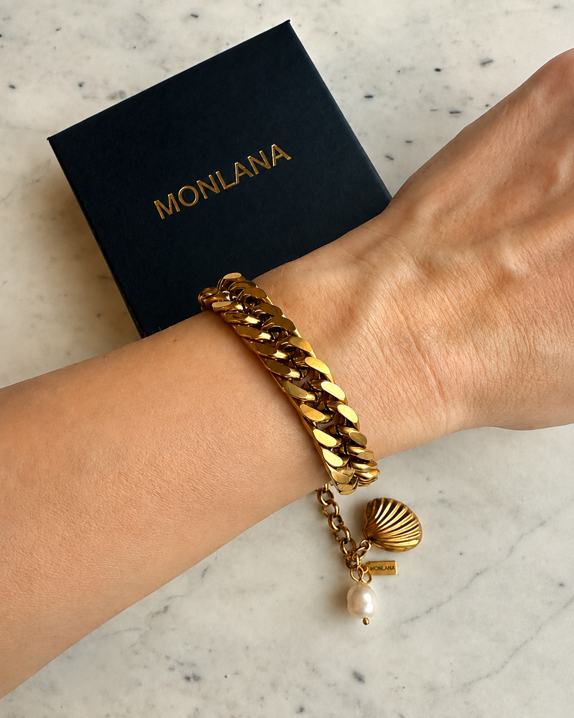 Gold Cuban chain bracelet with shell charm and pearl by MONLANA